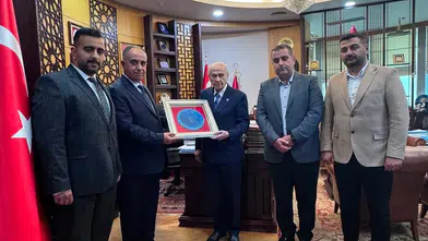 Görevden alınan Konya İl Başkanı oğullarıyla Bahçeli’yi ziyaret etti